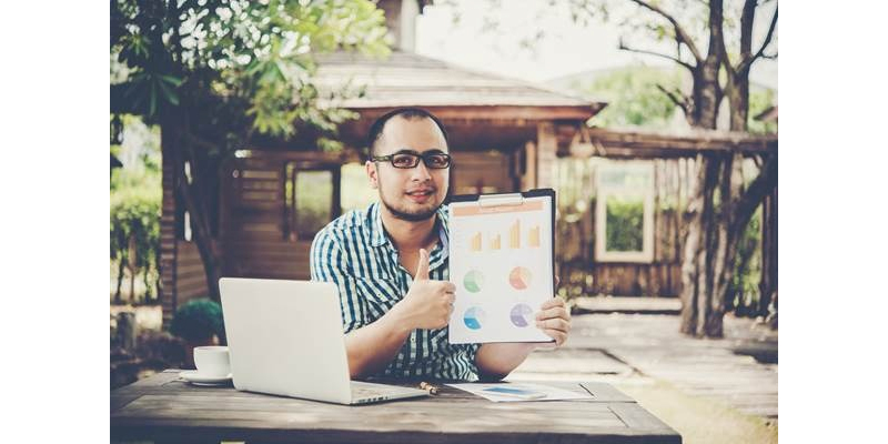 Investor analyzing property value growth at Eco Village Dharwad.